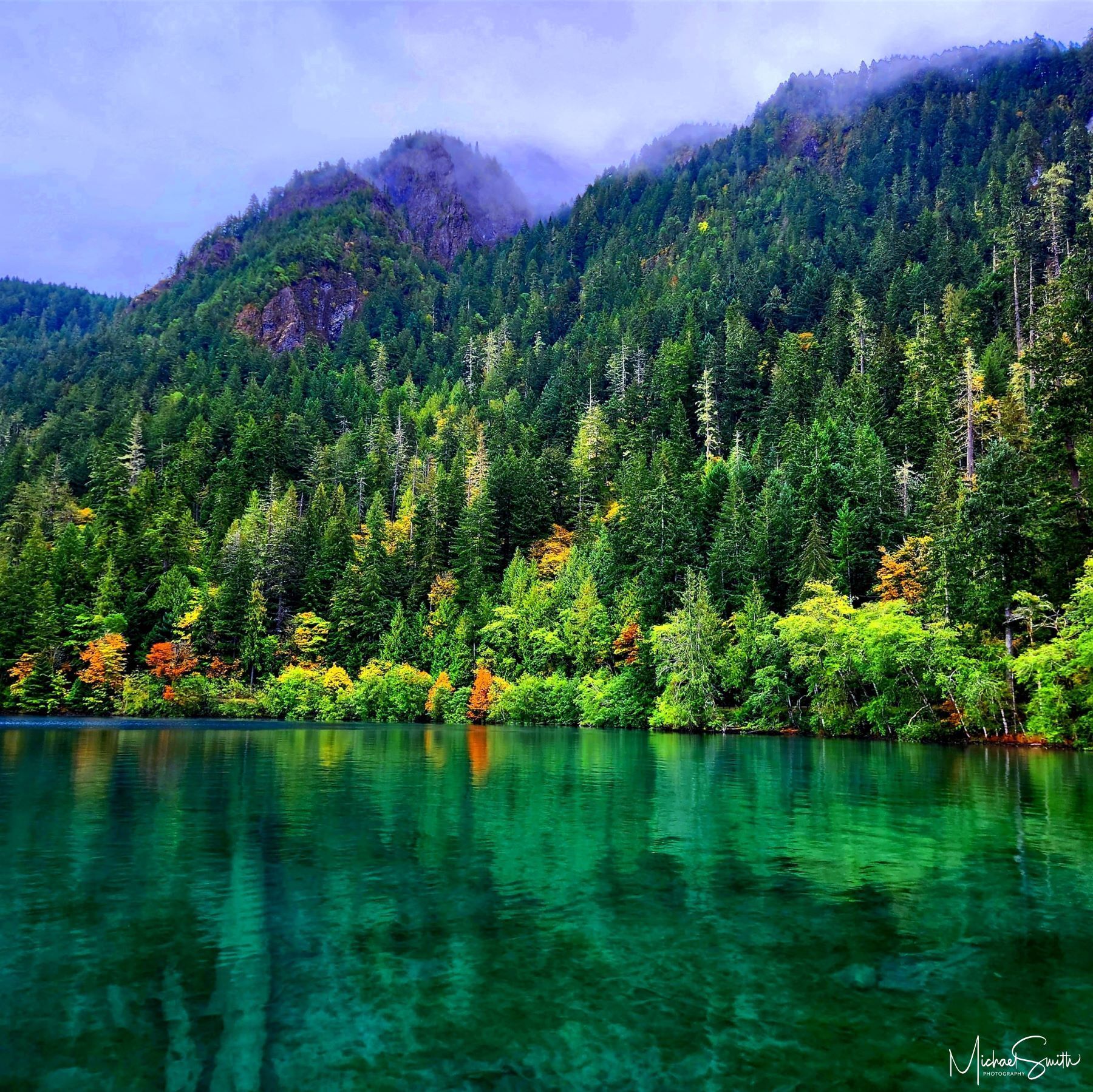 Misty Reflections Nestled in the heart of Washington State's Olympic National Park, Crescent Lake is a haven of serene beauty and a true...