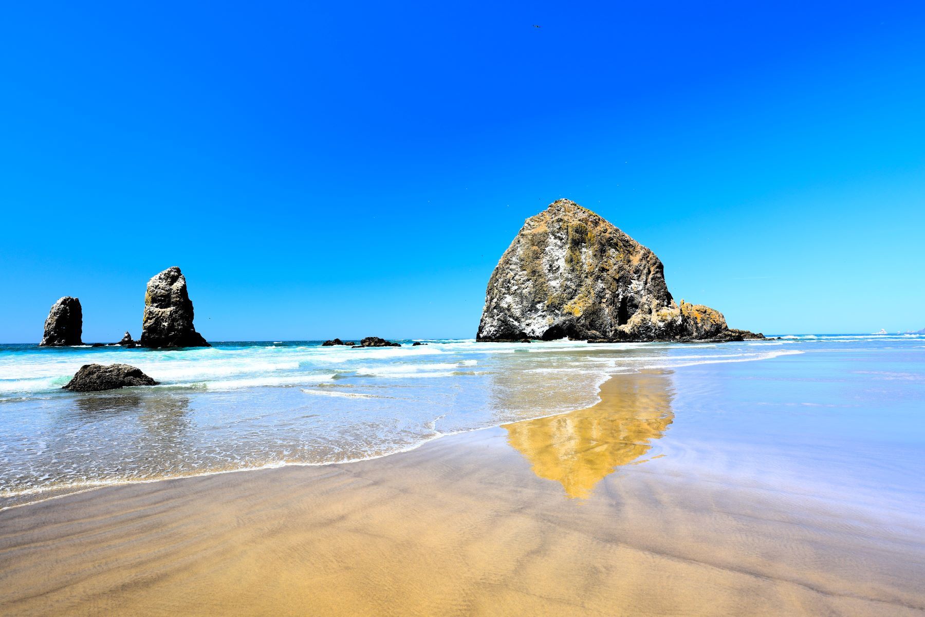 Reflection Rock - Cannon Beach Perched majestically along the scenic, windswept coastline of Cannon Beach, Oregon, the legendary Reflection...